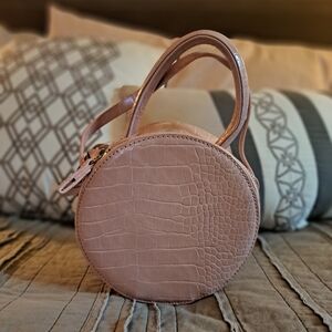 Pink circle patent leather crossbody